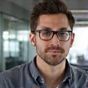 Portrait of a male software engineer with glasses.