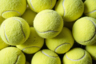Different types of tennis balls, including pressureless and regular